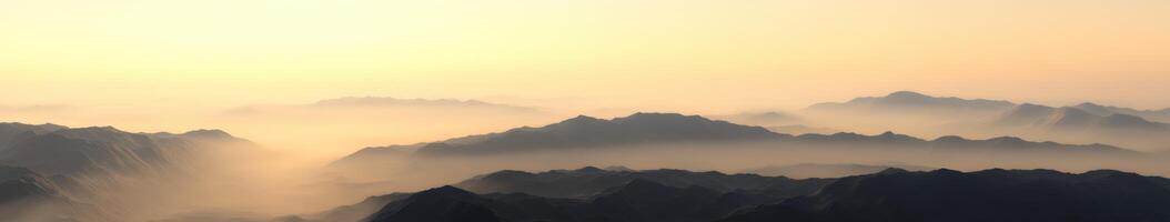 Foggy mountains during evening light photo