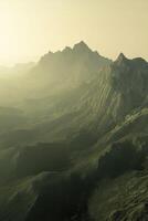 Fog-covered mountains at dusk creating a serene atmosphere photo