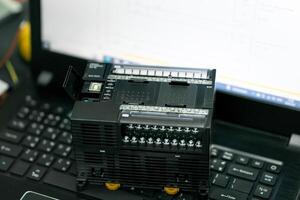 Programmable Logic Controller or PLC used in modern industrial manufacturing. photo