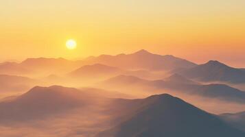 Evening fog envelops mountains at sunset photo