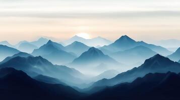 Fog-covered mountains at dusk with a setting sun photo