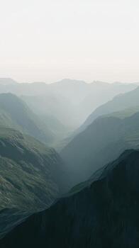 Fog envelops mountain valleys during evening hours photo
