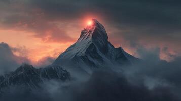 Evening fog envelops majestic mountains under a glowing sunset photo
