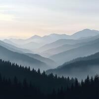 Foggy evening mountains with layers of mist and trees photo