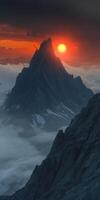 Evening fog envelops majestic mountains under a glowing sunset photo
