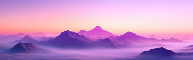 Foggy mountains in the evening light with a purple sky photo