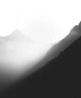 Fog envelops mountains in the evening light photo