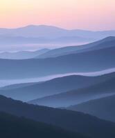 Evening fog envelops rolling mountains at twilight photo