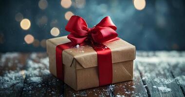 A beautifully wrapped gift sits elegantly on a wooden table, adorned with a shimmering red ribbon and a festive bow. The warm bokeh lights in the background evoke a cozy, celebratory video