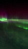 Northern lights view from space. Animation. Northern lights from the stratosphere. Northern Lights over lagoon in Iceland. Beautiful natural phenomenon Animation video