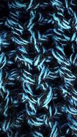 Wool texture, draped textile pattern closeup. Woolen texture fabric background. Visible details in delicate threads, that make up the woven fabric video