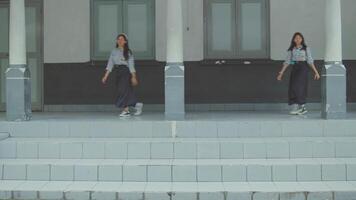 Woman walking across tiled platform in composite image video