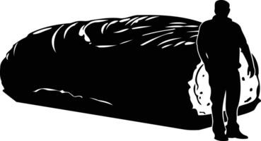 A silhouette of a man standing next to a large, rolled up object vector
