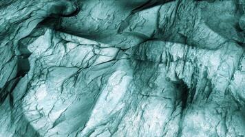 Stretched turquoise material with the pattern of crumpled paper. Motion. Movement of shapes under flexible material. video
