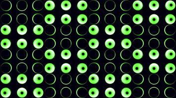 Black background. Design. A bright background with green and blue bright light bulbs circles that shimmer with different colors in the animation. video