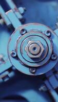 Big bolt. The rotating part of the machine. View of rotation machine in Printing house. Part of machine that is called the star, it changes rolls of paper continuously. manufacturing equipment video
