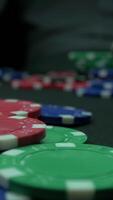 Close-Up of Man Throwing a Poker Chips in slow motion. Close-up of hand with throwing gambling chips on black background. Poker player increasing his stakes throwing tokens onto the gaming table. video