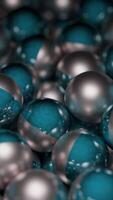 Colored metal balls move in stream. Design. Metal 3d balls move in large numbers in stream. Lots of 3d balls with metallic texture in motion video
