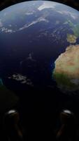 The rotating planet Earth. Design. A black background with the Earth making a defense around its axis in abstraction. video