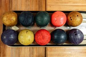 Bowling is a target sport and recreational activity in which a player rolls a ball toward pins photo