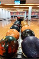 Bowling is a target sport and recreational activity in which a player rolls a ball toward pins photo