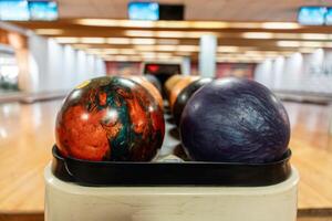 Bowling is a target sport and recreational activity in which a player rolls a ball toward pins photo