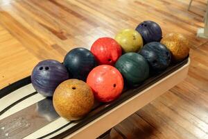 Bowling is a target sport and recreational activity in which a player rolls a ball toward pins photo