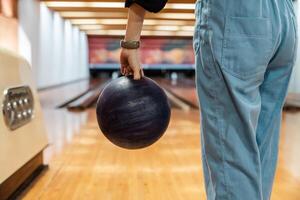 Bowling is a target sport and recreational activity in which a player rolls a ball toward pins photo