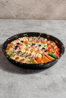 sushi is a Japanese dish of prepared vinegared rice, usually with some sugar and salt, accompanied by a variety of ingredients such as seafood, often raw and vegetables. photo