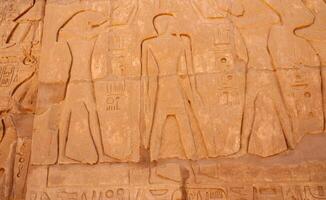 EGYPT, LUXOR - MARCH 01, 2019 ancient Egyptian hieroglyphs, drawings and inscriptions on the walls and columns in the temple of Karnak in Luxor photo