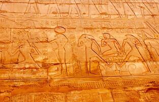 EGYPT, LUXOR - MARCH 01, 2019 ancient Egyptian hieroglyphs, drawings and inscriptions on the walls and columns in the temple of Karnak in Luxor photo