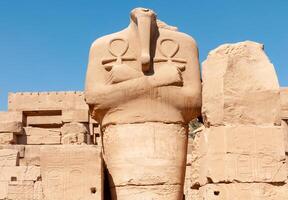 EGYPT, LUXOR - MARCH 01, 2019 ancient sandstone statues, Karnak Temple, Hall of caryatids. Luxor, Egypt photo