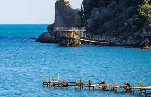 KARA-DAG, UKRAINE - APRIL 29, 2013 Bay with clear water near Mount Koba-Kaya, Novyi Svet, Crimea photo