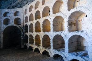 KARA-DAG, UKRAINE - APRIL 29, 2013 Golitsyn Grotto - wine racks carved in Koba-Kaya Mountain, Novyi Svet, Crimea photo