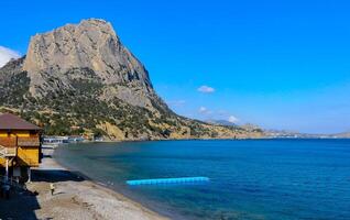 KARA-DAG, UKRAINE - APRIL 29, 2013 Bay with clear water near Mount Koba-Kaya, Novyi Svet, Crimea photo