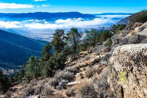 Beautiful mountain scenery on the background of clouds, layers of mountains on the horizon, Sierra Nevada Mountains, California, USA photo