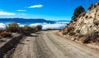 Beautiful mountain scenery on the background of clouds, layers of mountains on the horizon, Sierra Nevada Mountains, California, USA photo