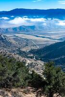 Beautiful mountain scenery on the background of clouds, layers of mountains on the horizon, Sierra Nevada Mountains, California, USA photo