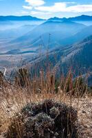 Beautiful mountain scenery on the background of clouds, layers of mountains on the horizon, Sierra Nevada Mountains, California, USA photo