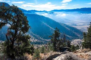 Beautiful mountain scenery on the background of clouds, layers of mountains on the horizon, Sierra Nevada Mountains, California, USA photo