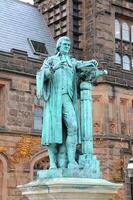 PRINCETON, NJ -15 NOVEMBER 2011 View of the facade of East Pyne Building and a statue of Princeton University President John Witherspoon on the Princeton University campus, New Jersey, USA photo