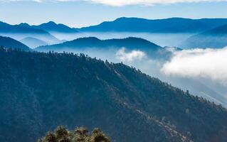 Beautiful mountain scenery on the background of clouds, layers of mountains on the horizon, Sierra Nevada Mountains, California, USA photo