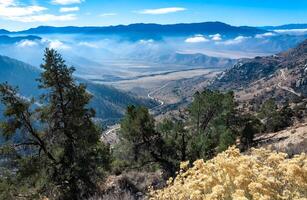 Beautiful mountain scenery on the background of clouds, layers of mountains on the horizon, Sierra Nevada Mountains, California, USA photo