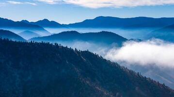 Beautiful mountain scenery on the background of clouds, layers of mountains on the horizon, Sierra Nevada Mountains, California, USA photo
