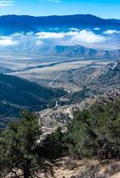 Beautiful mountain scenery on the background of clouds, layers of mountains on the horizon, Sierra Nevada Mountains, California, USA photo