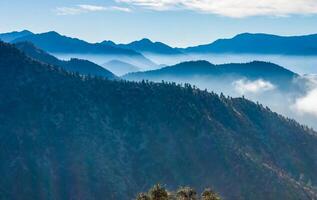 Beautiful mountain scenery on the background of clouds, layers of mountains on the horizon, Sierra Nevada Mountains, California, USA photo