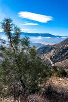 Beautiful mountain scenery on the background of clouds, layers of mountains on the horizon, Sierra Nevada Mountains, California, USA photo
