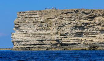 High Coastal cliffs from layered Pontic limestone in the western Crimea, Tarkhankut photo