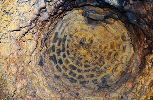 Walled domed vertical shaft in the old Odessa catacombs, cut out in the Pontian shell rock under the city photo