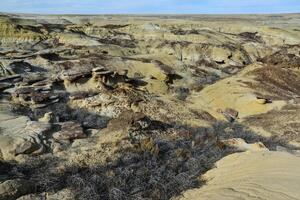 Weird sandstone formations created by erosion at Ah-Shi-Sle-Pah Wilderness Study Area in San Juan County near the city of Farmington, New Mexico. photo